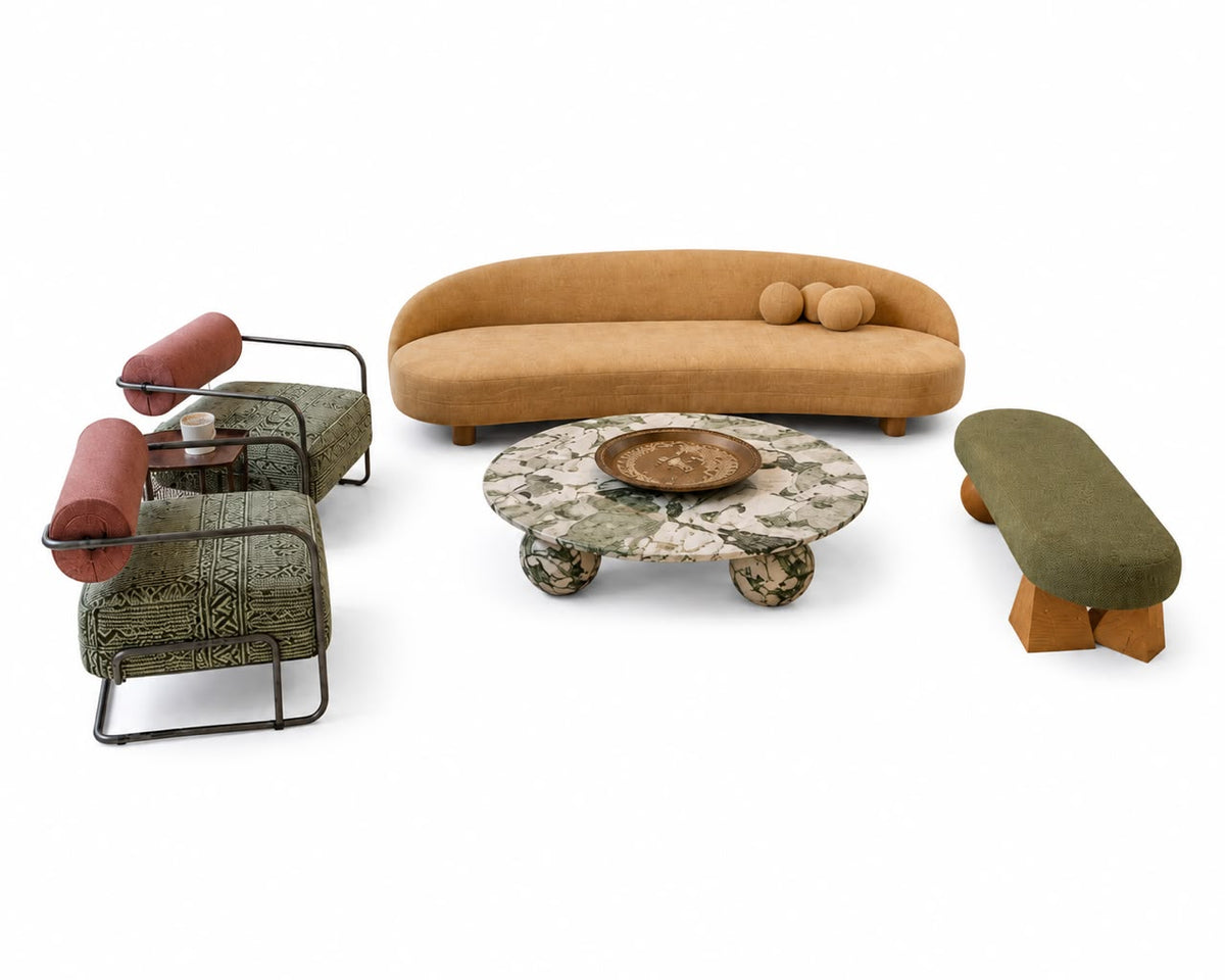 The Dune Lounge Set by Soul Alchemy Living featuring a curved sand sofa, two terracotta bolster armchairs, and a moss green bench around a marble coffee table